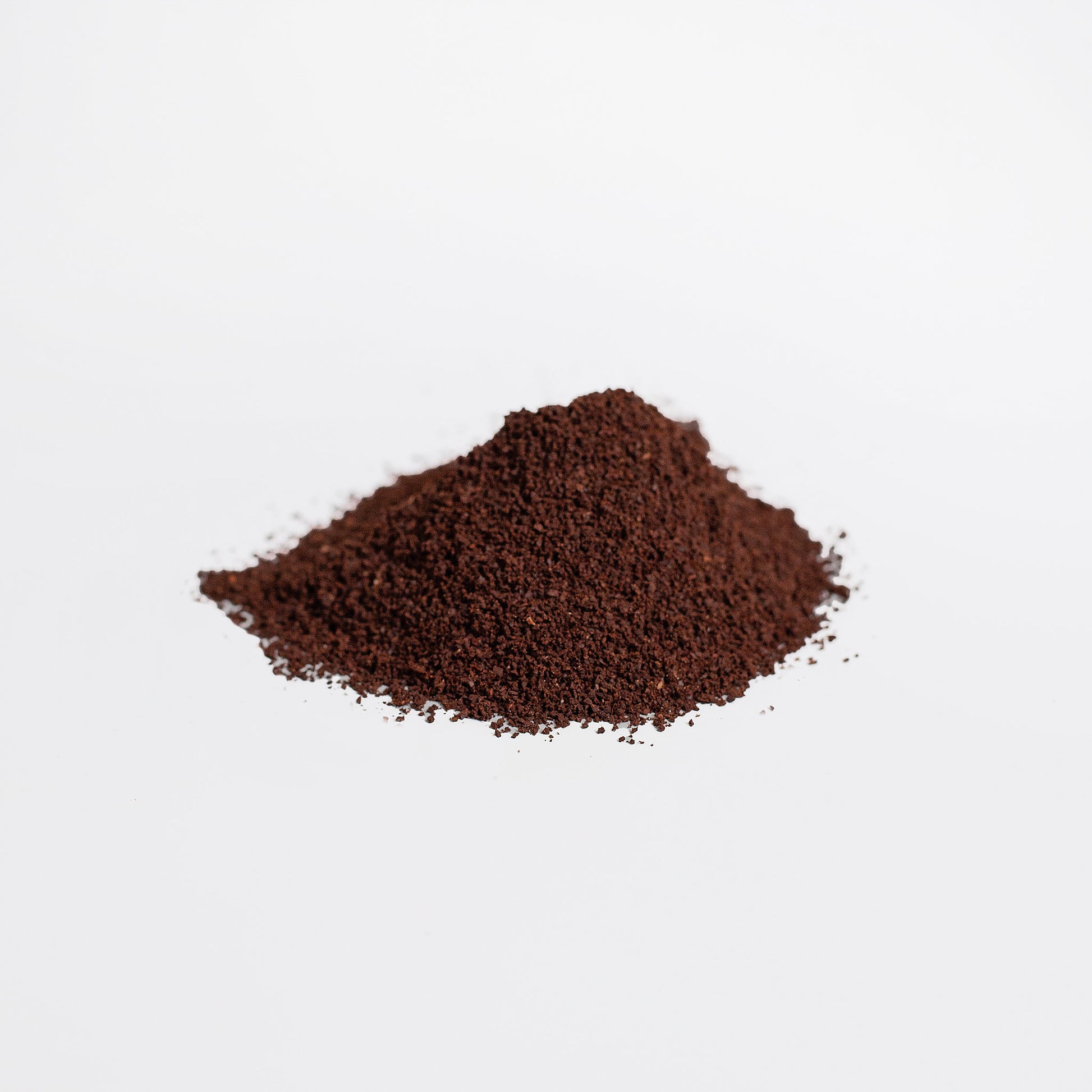 Pile of ground hemp coffee on a white background
